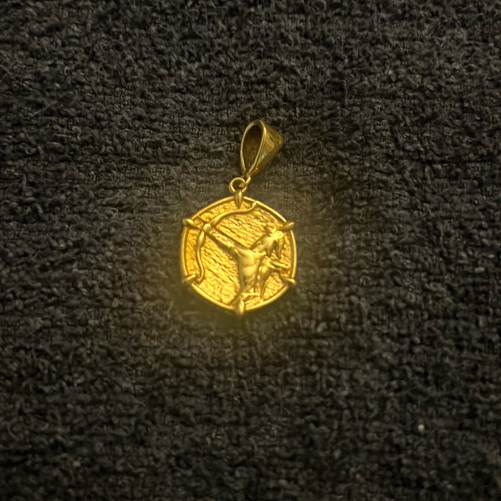 Gold tone solid Sagittarius pendant